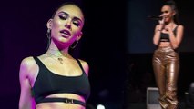 Madison Beer showcases taught torso in black bralette and gold pants during New York concert