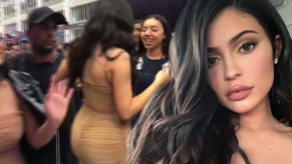 Kylie Jenner flashes the flesh in low cut cream dress as she greets fans at pop up make-up store