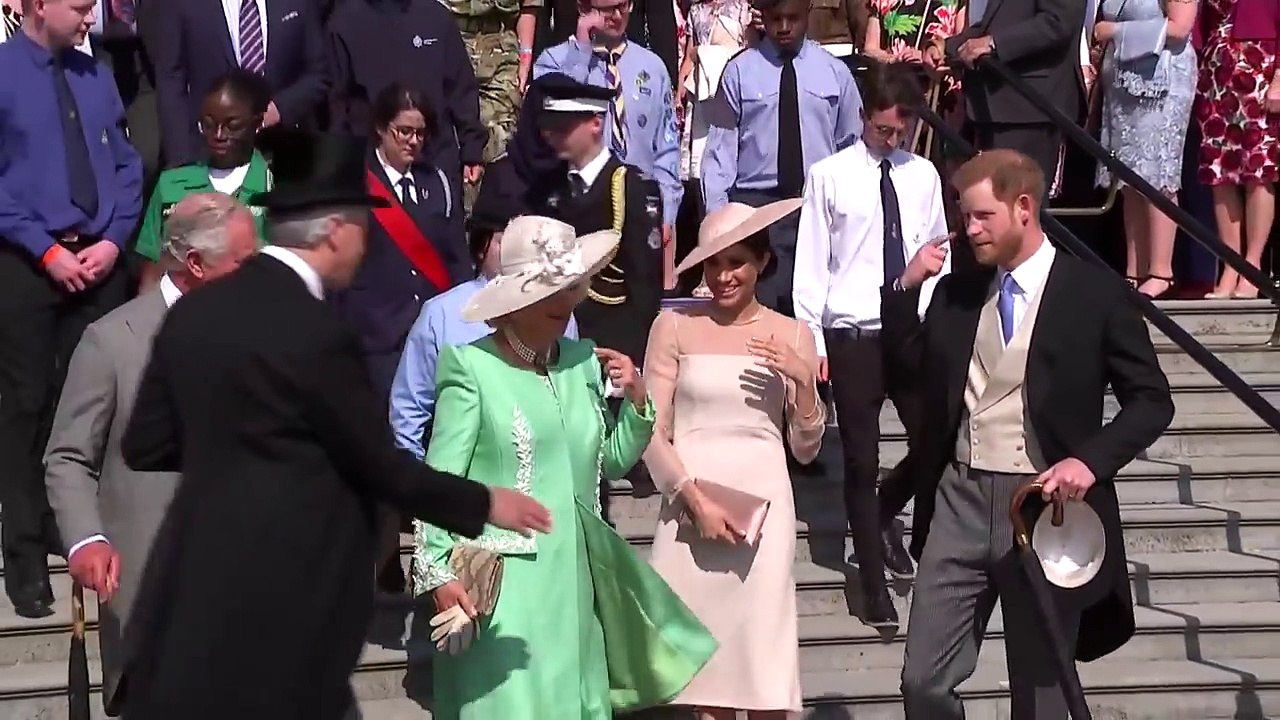 Meghan shares a joke with Camilla at Prince Charle's 70th birthday at Buckingham Palace