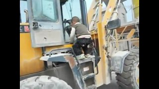 5yr old boy drives front loader, video will leave