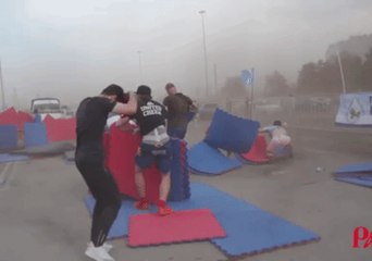 Sports Festival Crew Scrambles to Grab Equipment Sent Flying by Siberian Hurricane