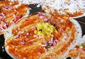 Street Food Vendor Prepares Traditional Pancake Crepe Dish