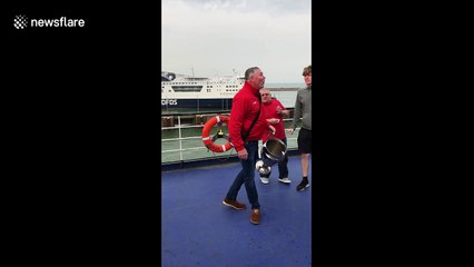 Road-tripping Liverpool fans play catch with replica Champions League trophy