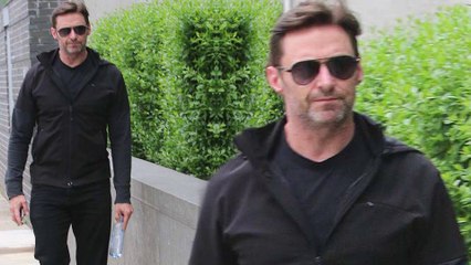 Black to basics! Hugh Jackman cuts a casual figure in a sweater and aviators as he steps out in New York City