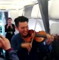 Professional Violinist Gives Performance For Passengers On Delayed Flight