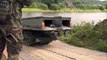 NATO Armored Vehicles Cross River On Pontoon Bridge