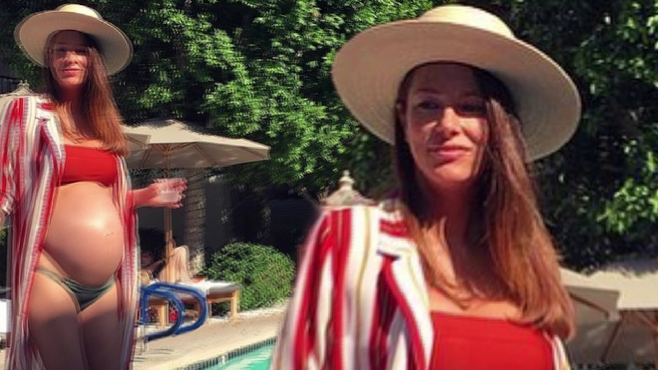 Hot mama! Heavily pregnant former Home And Away star Esther Anderson flaunts her blossoming bump in a bikini as she soaks up the sun on her 'baby moon'