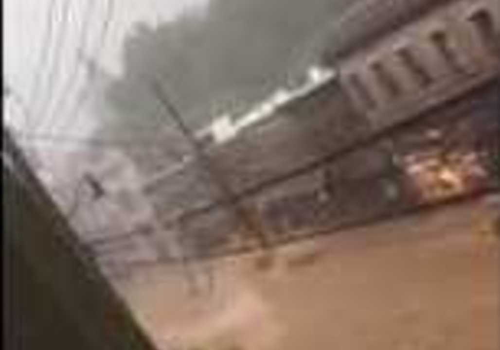 Torrent of Floodwater Rushes Down Street in Ellicott City