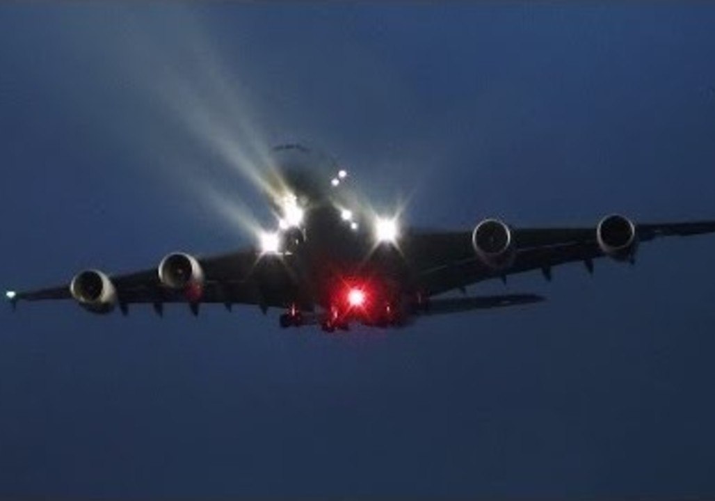 A380 Airbus Lands at Heathrow Airport on a Rainy Night
