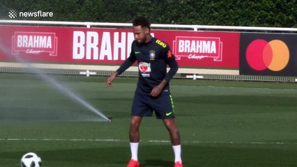 Neymar got soaked by sprinkler and doesn't look very happy about it