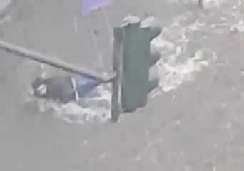 Flooding Topples Pedestrian in Wuppertal