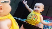 Cute Baby Girl Kisses Mirror and Enjoys her Mirror Reflection