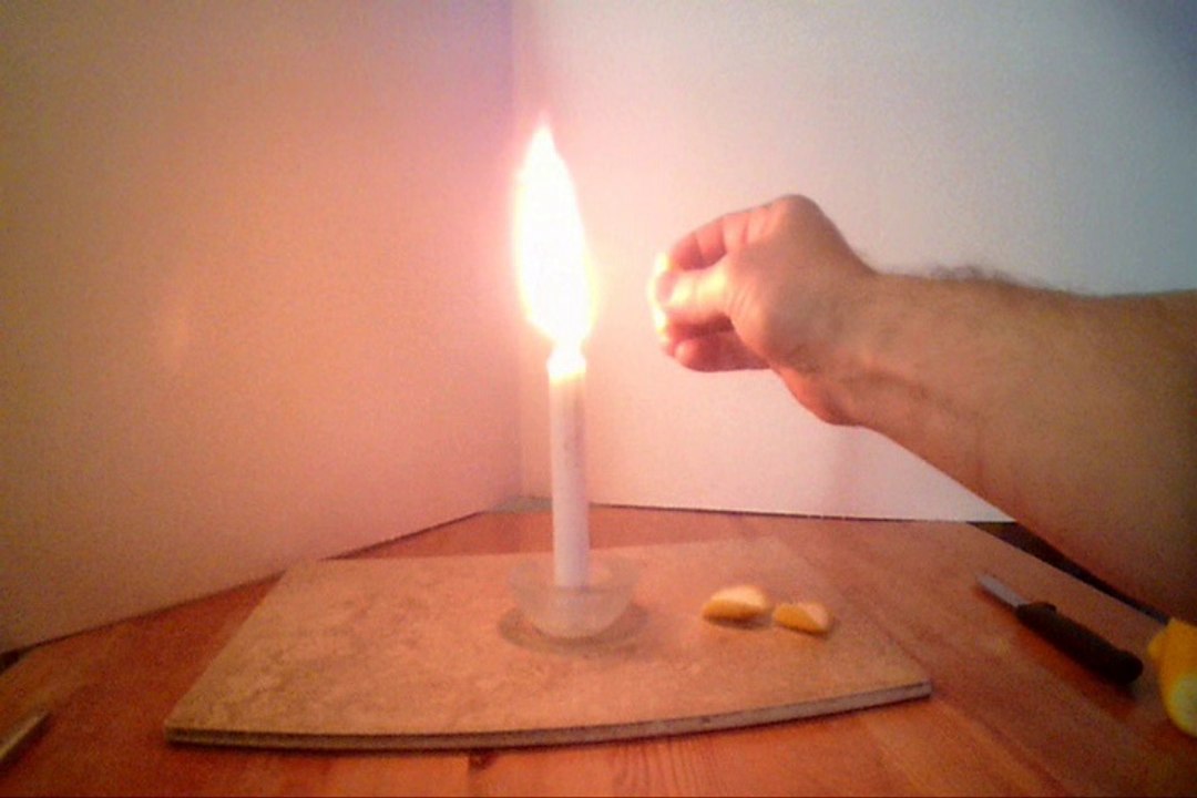 2134 . HOW THE BARTENER LIGHTS YOUR LEMON ON FIRE , FOR YOUR DRINK.