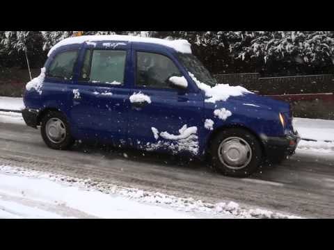Drivers in Bristol slipping down a hill after snow and hit hit city