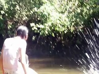 Taking a bath in the river in El Salvador