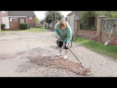 80 year old woman left to fill potholes by council