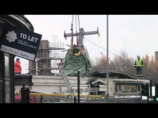 Rescue workers remove police helicopter from Clutha Bar