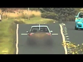 Man caught speeding while he drove along with both hands BEHIND HIS HEAD.