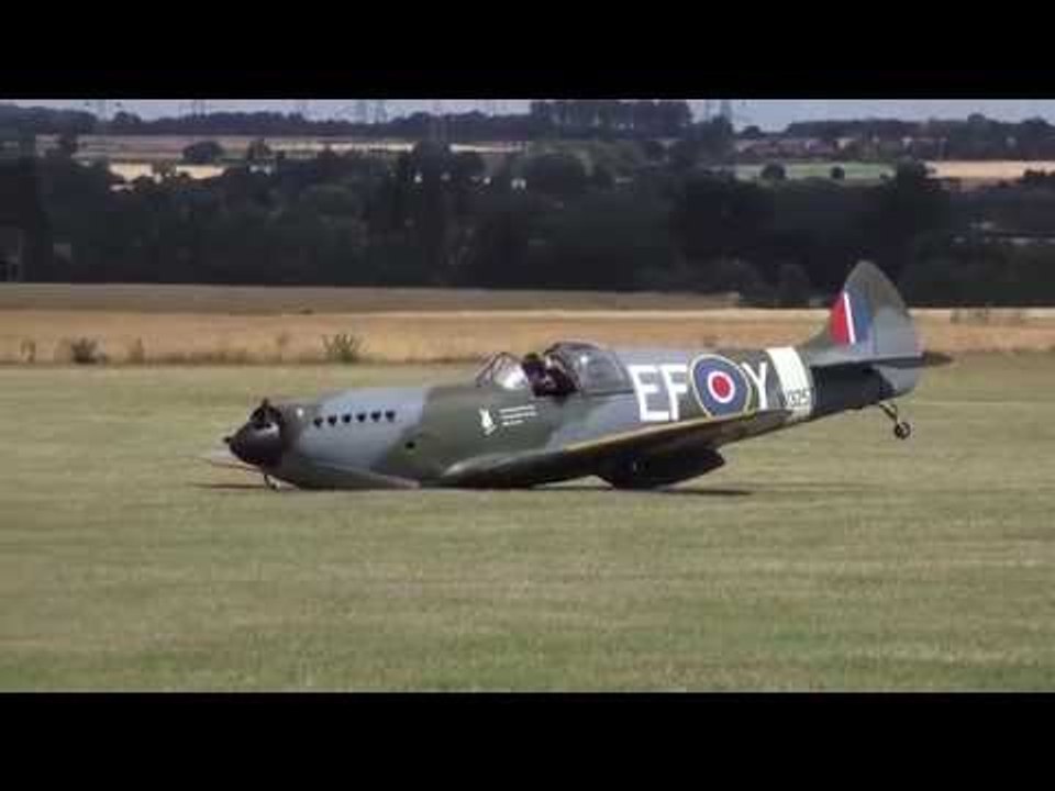 Dramatic moment a replica Spitfire lands without undercarriage