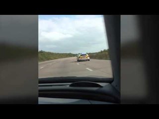 Maniac films himself chasing police car at 120mph