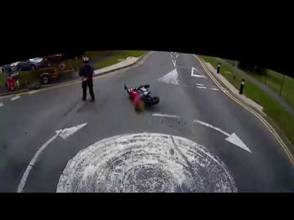 Brainless biker overtakes lorry, crashes into van and angrily throws gloves in hedge