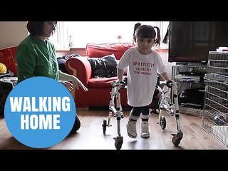 Brave Georgie Gibbs takes first steps back home following operation