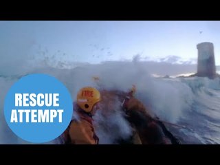 Dramatic footage of rescue attempt of a woman who was swept away at sea