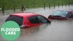 Flooding Caused By Heavy Rain Has Risen To Chest Hight Submerging Cars