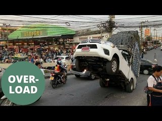 Hilarious moment overloaded pick up truck fell over backwards