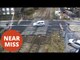driver dodges level crossing barriers going DOWN