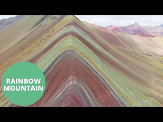 drone footage of psychedelic rainbow mountains in Peru