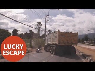 Moped driver survives being crushed by truck