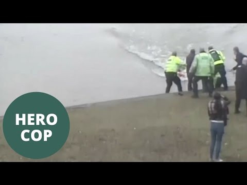 Hero cop dive into freezing water to save drowning man from river ...