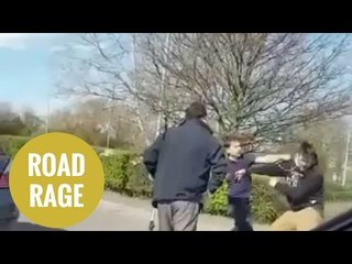 Shocking moment an outnumbered driver is repeatedly punched