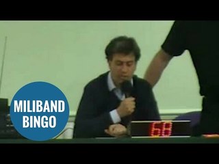 Ed Miliband reading numbers at community bingo night