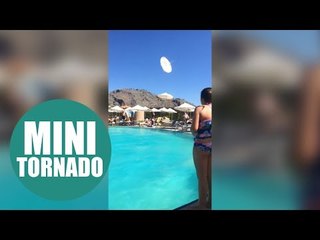 Shocking footage shows mini-tornado in hotel swimming pool