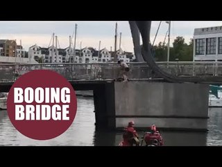 Homeless man threatening to jump off bridge in protest at his housing situation