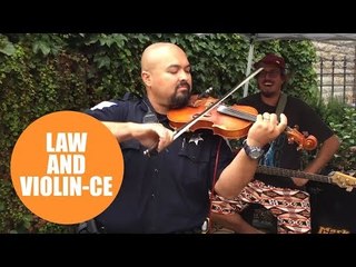 Revellers who thought cop was about to shut down gig stunned when he starts playing violin