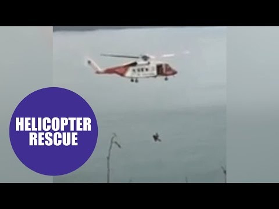 Incredible video shows Coastguard helicopter rescuing a teenager from the bottom of a 150ft cliff