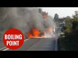 Cop car collides with BMW and dramatically bursts into flames