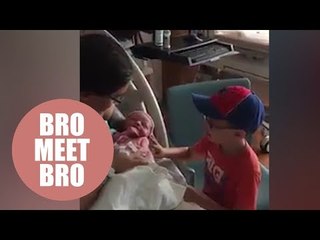 Nervous mom watches her autistic five-year-old meet his baby brother for the first time