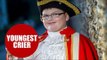 A boy scout is proud to be the world's youngest town crier - at the age of 11