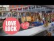 Romantic Brummies place padlocks on a bridge over a Birmingham canal