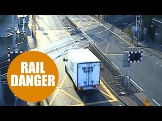 Dozy van driver banned for smashing through a level crossing to try to beat the barriers