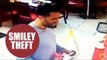 Brazen thief caught on CCTV stealing charity box from fast food restaurant while joking with staff