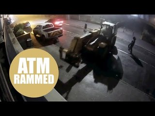 Ram raiders trying to rip cash machine from shop using digger