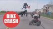 Moment motorcyclist is thrown 10ft into the air after failed wheelie