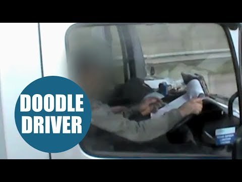 Shocking footage shows lorry driver writing on notepad while driving