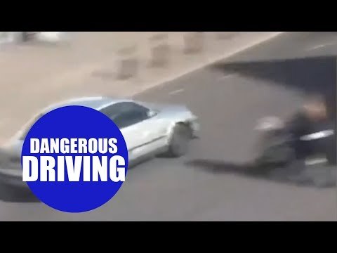 Boy racer almost mowing down mum and baby while speeding through town centre