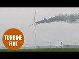A wind turbine catches fire after thunder and lightening strikes